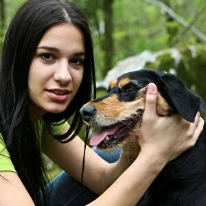 Young Woman in the Wood with Dog