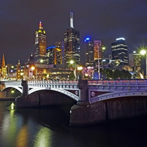 Australia, Melbourne, Princes Bridge and cityscape illuminated at dusk
