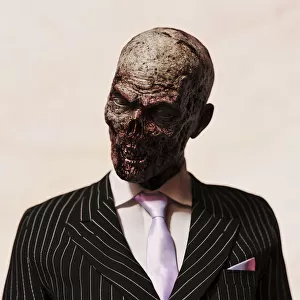 Zombie: surreal studio portrait of a zombie businessman in suit and tie