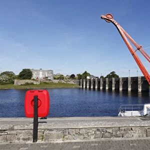 Crane on a jetty, Old Fort and old bridge over the River Shannon, Shannonbridge, County Offaly and Roscommon, Ireland, Europe
