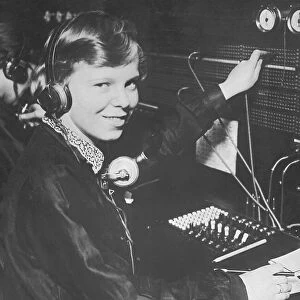 Female switchboard operator, portrait (B&W)