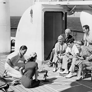 Group of people playing game on deck, of cruise ship B&W), (B&W)