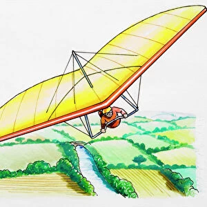 Hang glider above rural landscape