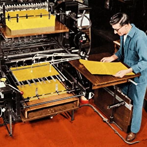 Man Working at a Printing Press