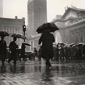 People with umbrellas in urban scene