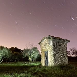 Small country house one night with stars