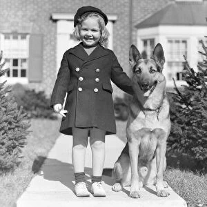 Smiling Girl With A German Shepherd Wearing A Tam & Brass 6 Button Navy Overcoat With
