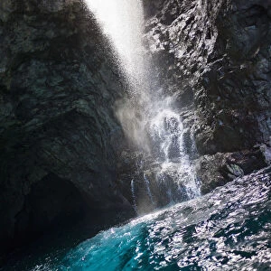 Waiahuakua sea cave explored on boat tour of Na Pali Coast, Kauai, Hawaii, USA