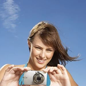 Woman Taking a Photograph