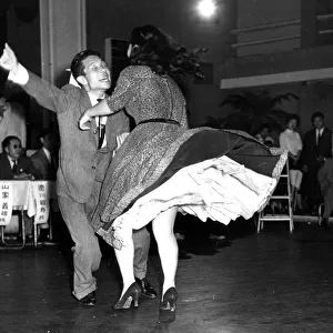 Couple energetically Dancing jive or jitterbug 1950s dance / dancing / party