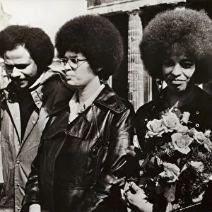 On 11 September 1972 the brave American communist and civil rights defender Angela Davis was cordially welcomed by the soldiers of the National Peoples Army of the German Democratic Republic at the Brandenburg Gate (b / w photo)