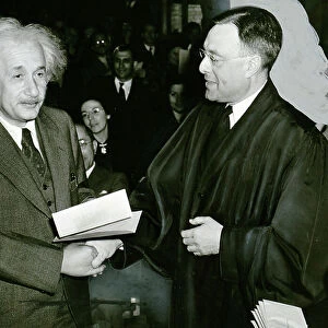 Albert Einstein receiving from judge Phillip Foreman, his certificate of American citizenship, 1940 (b/w photo)