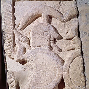Ancient stele with a relief of a warrior (stone)
