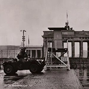 British armoured car on the border between East and West Berlin at the Brandenburg Gate (b / w photo)