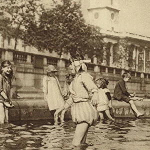 Children enjoying a paddle in Trafalgar Square during a heatwave (b / w photo)