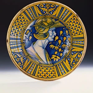 A Deruta lustred portrait dish painted in blue and lustred in yellow depicting a warrior
