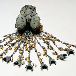 Double egg pendant, Igbo-Ukwu, 9th - 10th century (leaded bronze)
