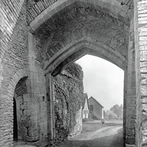 The east gatehouse, Beverston Castle, from Country Houses of the Cotswolds (b/w photo)
