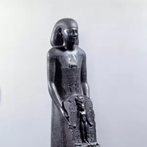 Egyptian antiquite: warrior statue in basalt. Its covered with hieroglyphs