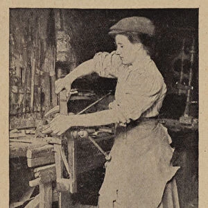 An English woman-blacksmith filing a horse shoe (b / w photo)