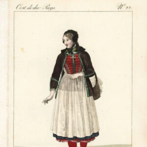 Girl of the Canton of Solothurn, Switzerland, 19th century. She has removed her straw hat to reveal the black velvet toquet. She wears a jacket over laced bodice, apron and many petticoats