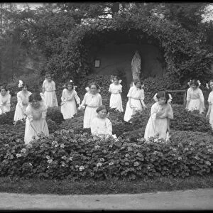 Graduating class of girls from the Roman Catholic Orphan Asylum in the flower garden