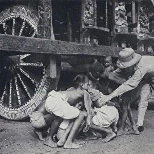 Hindu attempting to get themselves crushed under the wheels of the car of Jagannath (Juggernaut) in the belief they will go to paradise, Puri, India (b / w photo)