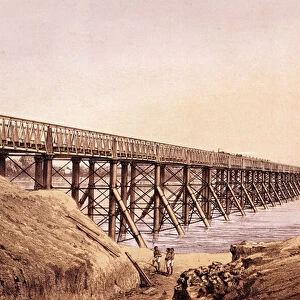 Industrial revolution: a metal bridge in India built by the British for the passage of the train. Engraving from Humbers Iron Construction