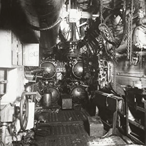 Interior of forward compartment of U-boat 135 showing torpedo and four torpedo tubes