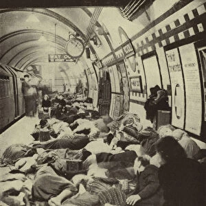 Londoners sheltering from a German air raid on a platform in Piccadilly Underground Station during the Blitz, World War II, September 1940 (b / w photo)