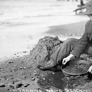 Man Panning Gold on Beach, Nome, Alaska, c. 1910 (b / w photo)