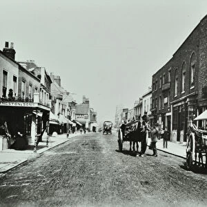 Putney High Street, looking towards bridge, 1885 (b / w photo)
