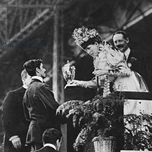 Queen Alexandra handing a special cup to Dorando to commemorate his great effort to win