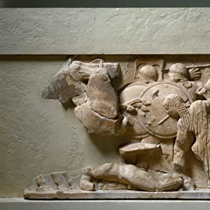 Scene of gigantomachia, Apollo and Artemis fighting against a giant. 525 BC. (relief)