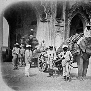 Soldiers with an elephant pulling a gun, 1858 (b / w photo)
