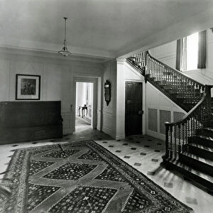 The staircase hall, Temple Dinsley, Hertfordshire, from The English Manor House (b/w photo)