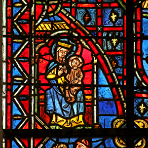 A statue of the Virgin Mary (stained glass)