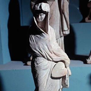 Terracotta figurines: woman standing draped with a fan, in the style "Tanagreen"