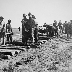 Track-layers gang-building the Union Pacific Railroad through American wilderness