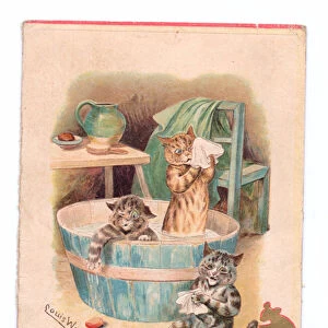 A Victorian Christmas card of two cats in a bathtub while two mice play with a bar of