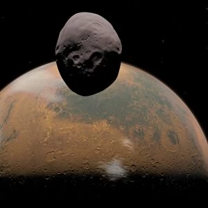 Artists concept of Mars and its tiny moon Phobos