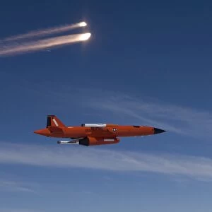 A BQM-74 target drone fires flares