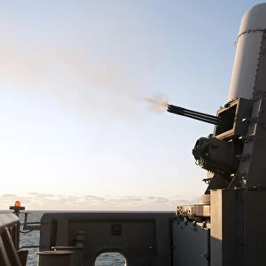 A close-in weapons system fires a burst of tungsten rounds