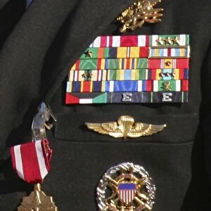 Close-up view of military decorations and honors on a commanders dress uniform