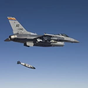 An F-16 Fighting Falcon releases a GBU-38 JDAM during a test mission