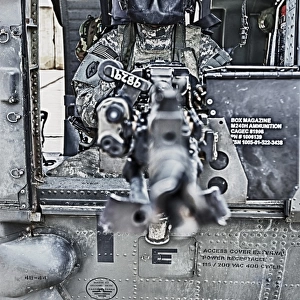 HDR image of a UH-60 Black Hawk door gunner manning a M240 machine gun