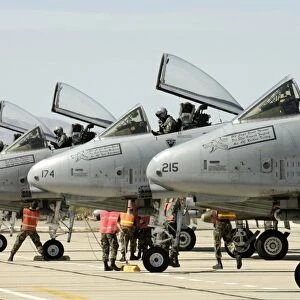 Maintainers perform pre-flight inspections on A-10 Thunderbolt II s