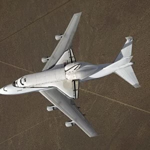 An overhead view of Space Shuttle Atlantis atop a modified 747 aircraft