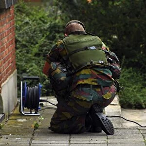 A soldier of the Belgian Army investigating a suspect building