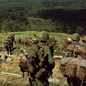 Soldiers descend the side of Hill 742, five miles northwest of Dak To, Vietnam